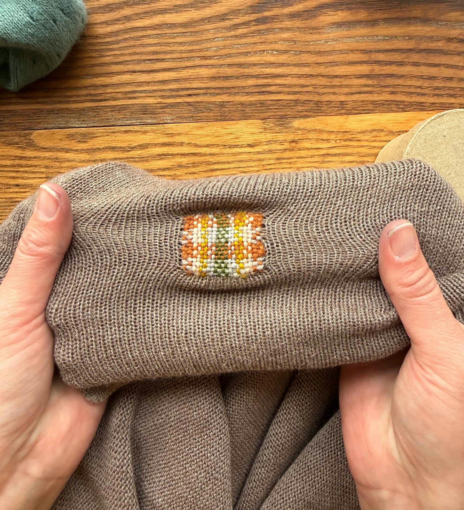 A clean-edged woven patch is very stable and allows the surrounding knit stitches to stretch as before.