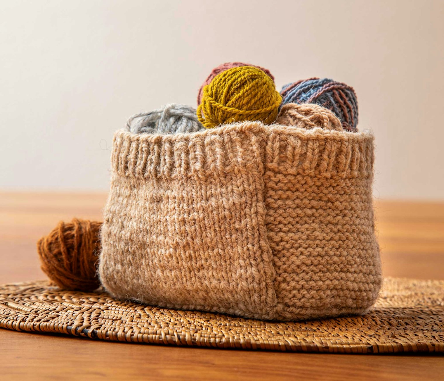 The Woolly Basket was designed to help Sabine understand a breed of sheep: some locks, small skeins, swatches, a piece of felt, and pictures of the animals in her environment. The beautiful natural golden color of the Coburg Fox wool shines through in this knitted version. Photo by Matt Graves