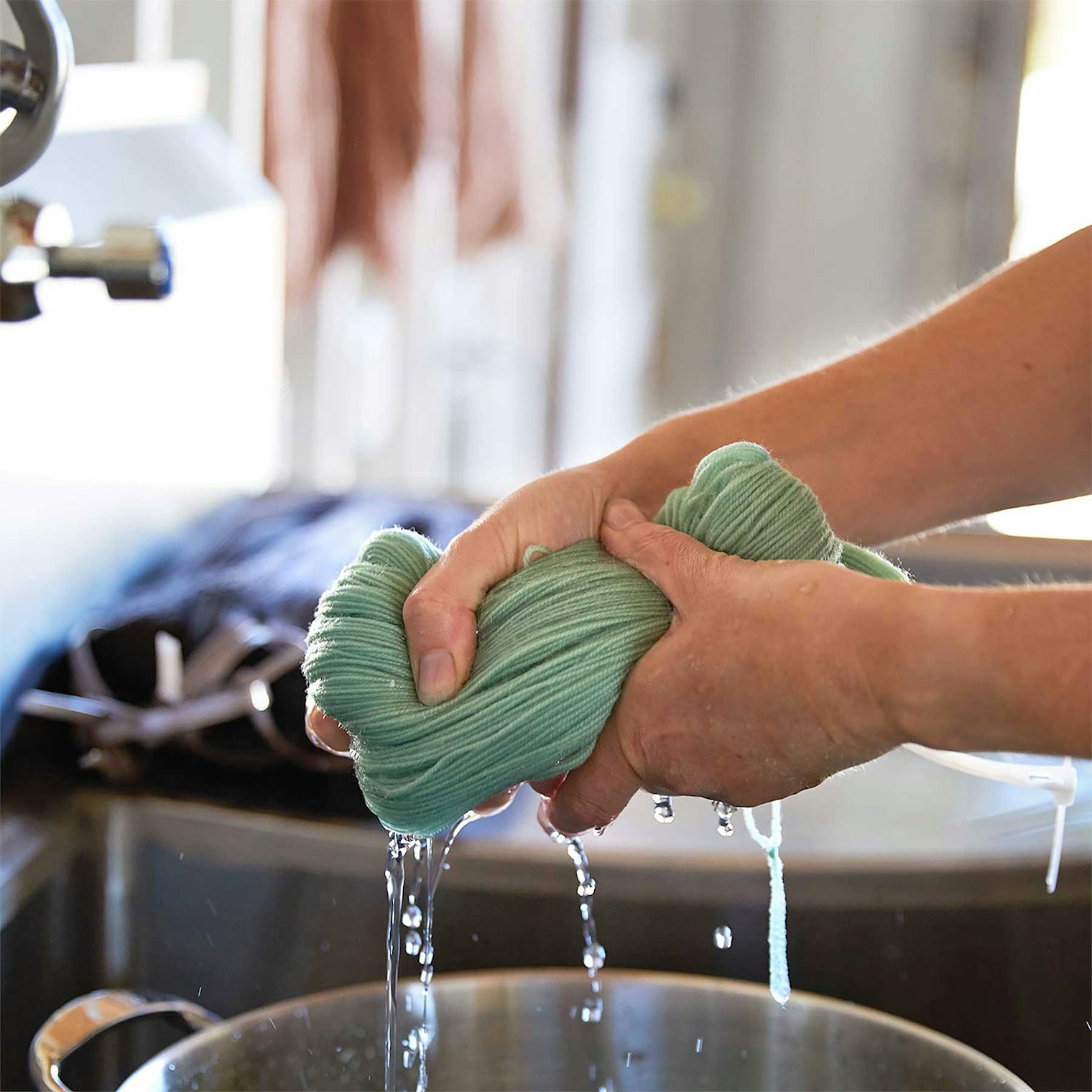 Washing and rinsing the yarn; photo by Amaren Colosi.