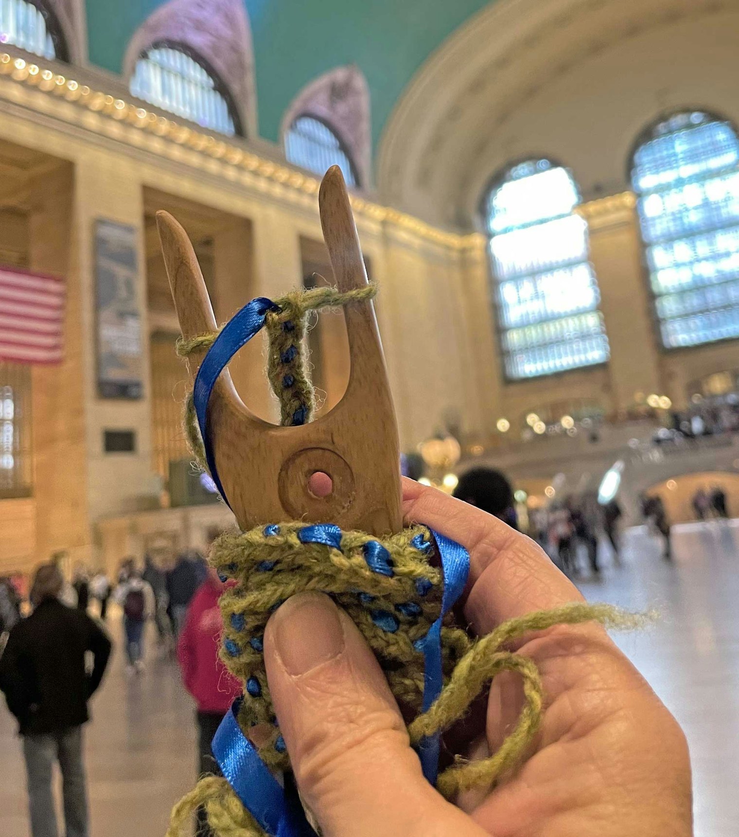 Cricket enjoyed one of Helen’s lucet braiding classes on Yell; a week later she was still hooked, and is shown here braiding in Grand Central Station in New York City. Photo by Cricket Cooper