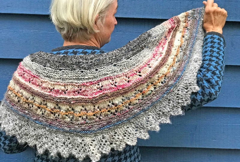 woman in colorful striped shawl