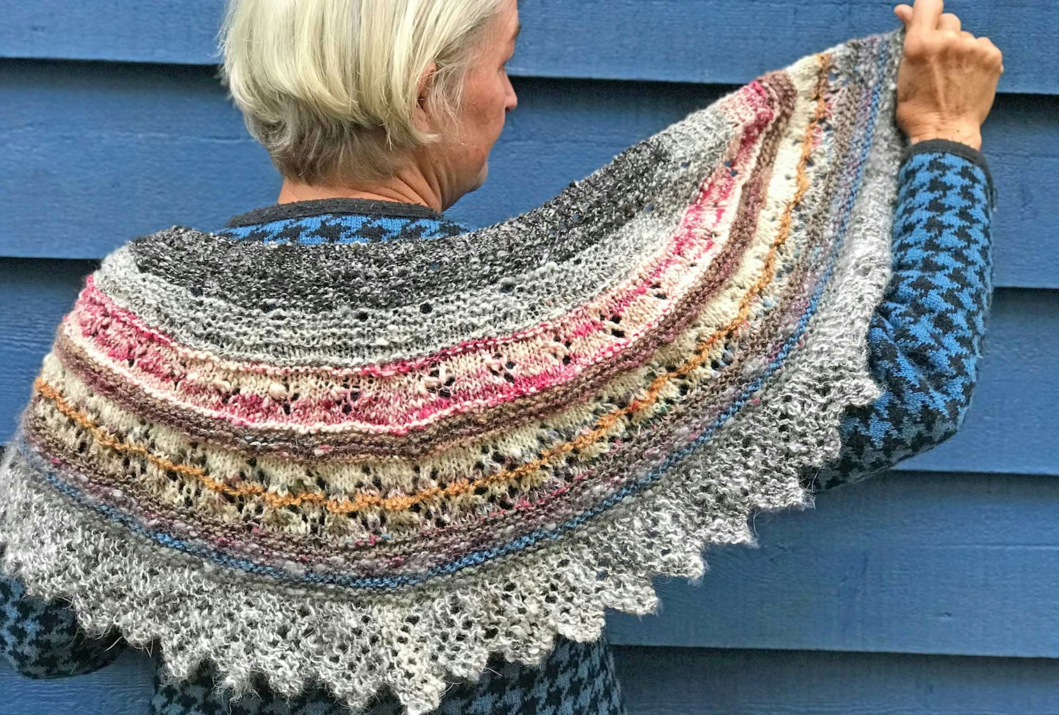 woman in colorful striped shawl