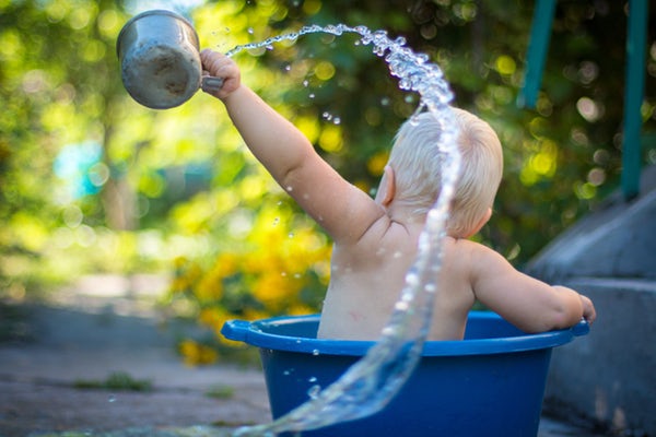 baby playing in water