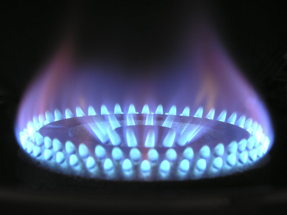 Blue Flames of Gas Burner. Background is black