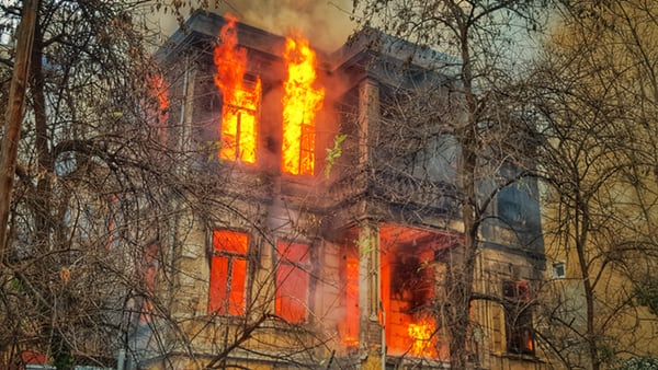 A burning house. An appropriate time to call 911.