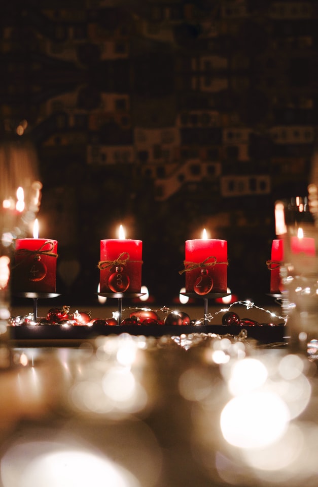 row of red burning holiday candles