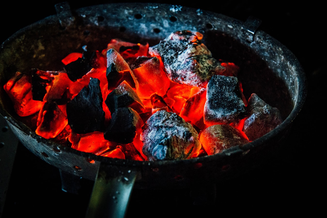 Charcoal being burned inside of a house giving off carbon monoxide.
