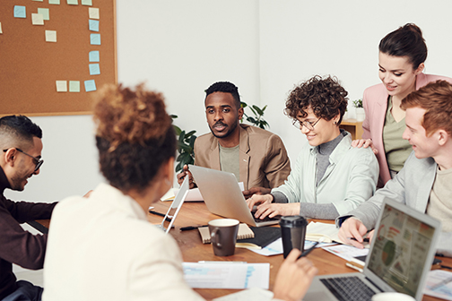 A group of people meeting together about a plan