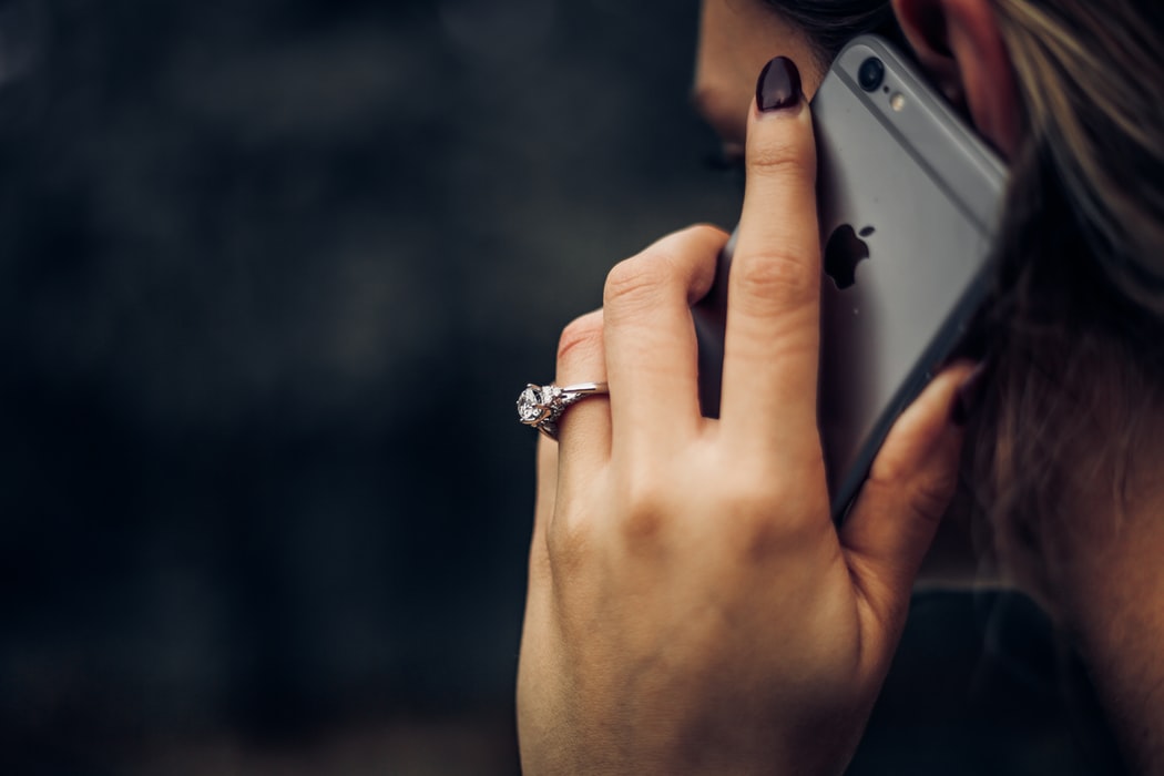 Woman locked out of house calling someone to let here in.