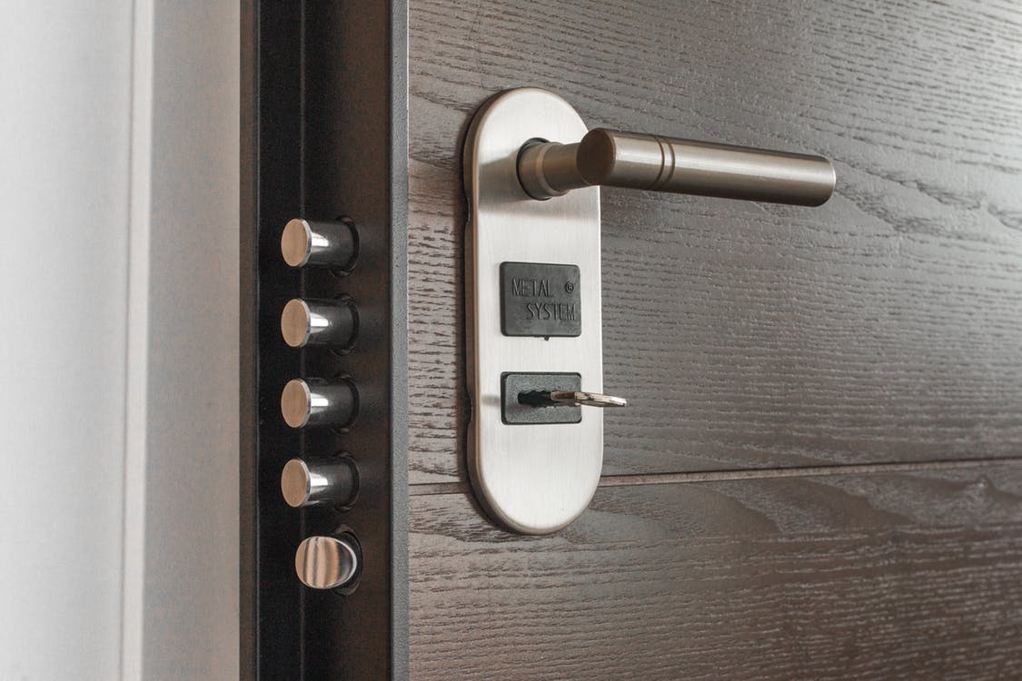 Intense Smart Lock on door that is opened a crack