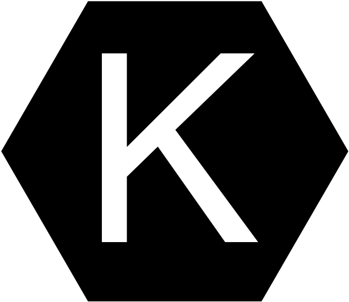 Class K Fire Extinguisher Symbol. White K surrounded by a black hexagon.