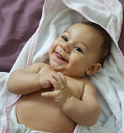 Happy Baby Lying on Blanket