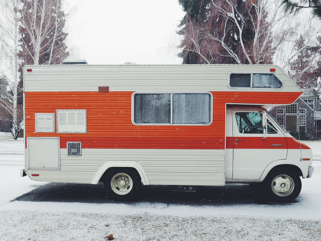 Orange and White RV in the Snow