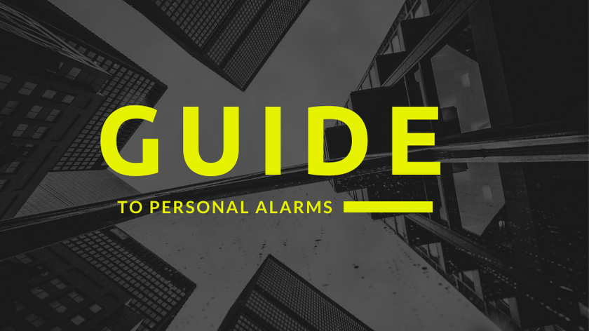 "Guide to personal Alarms" written in front of a camera shot of skyscrapers from below.