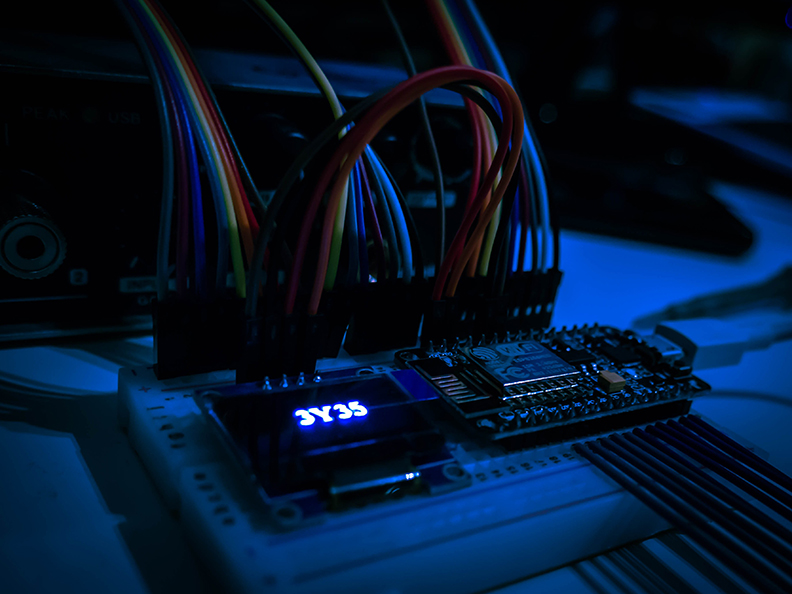 Multicolored Wires from Professionally Installed Security System sticking into a circuit board