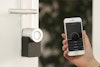 Keyless Smart Lock With Phone that has the app open to lock and unlock the lock.