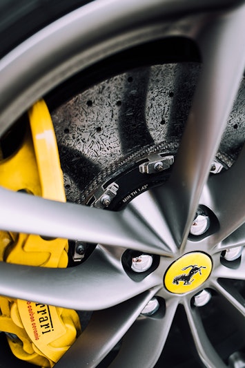 A close up wheel with a brake lock anti-theft device.