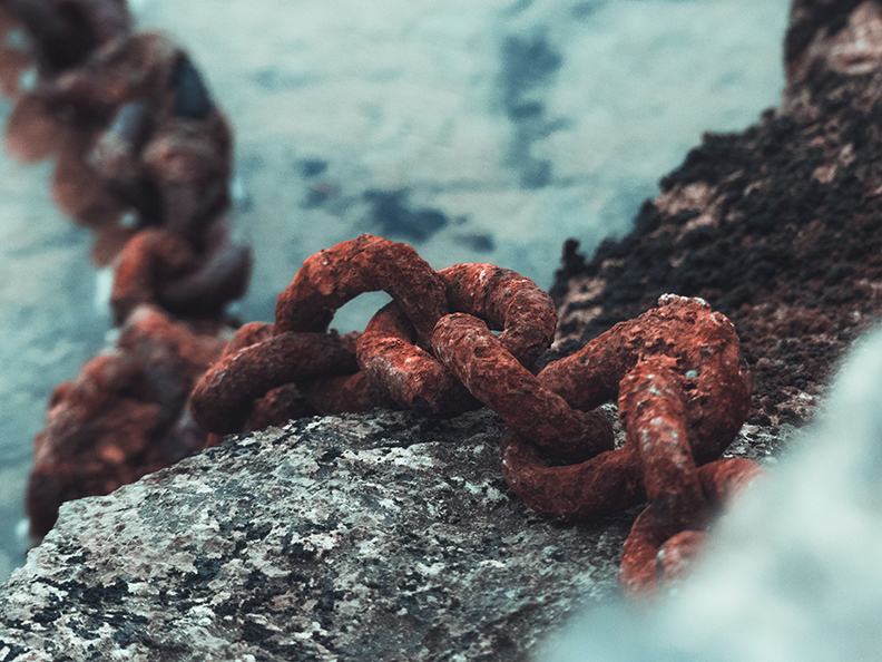 Corroded pipe and chain.