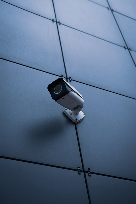 Cellular Security Camera Mounted on Black Wall Panels