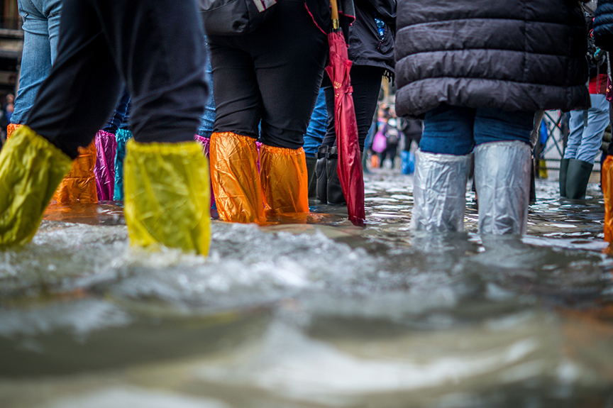People wearing flood boots