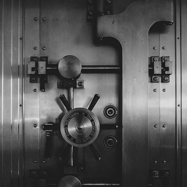 Steel  vault safe door with wheel to open.