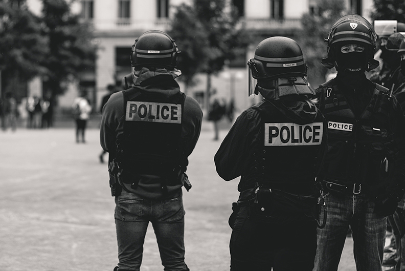Policeman in riot armor responding to an alarm