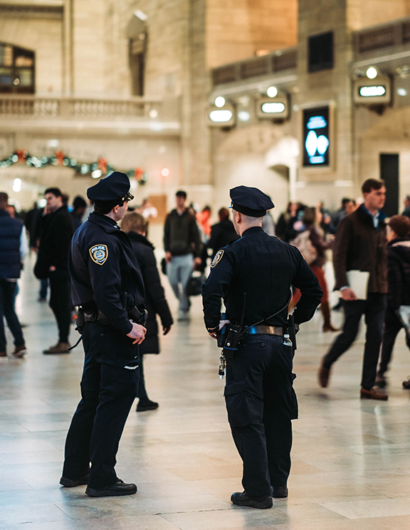 New York police officers trying to look out and lower the crime rate at grand central station.