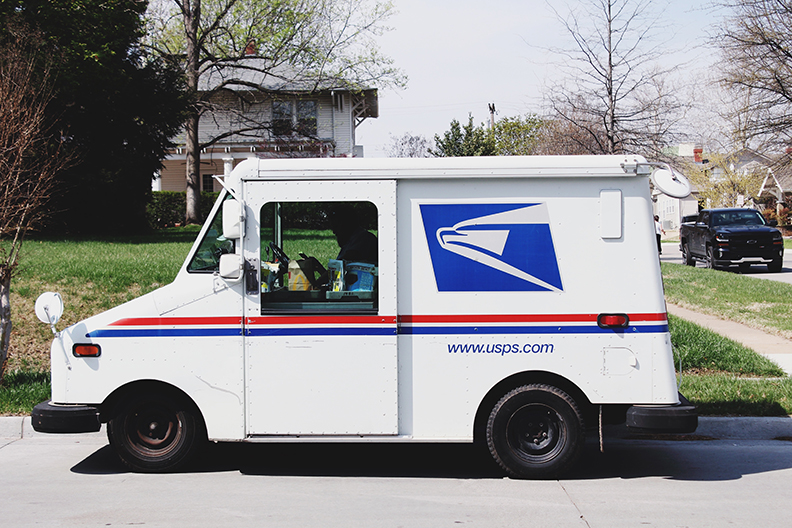 Delivery driver on his way to gated communities to deliver a package.