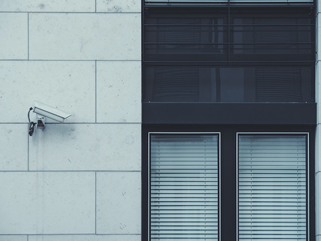Potentially invasive surveillance camera set up outside of a window.