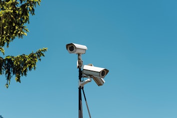 Surveillance system cameras mounted on a pole.