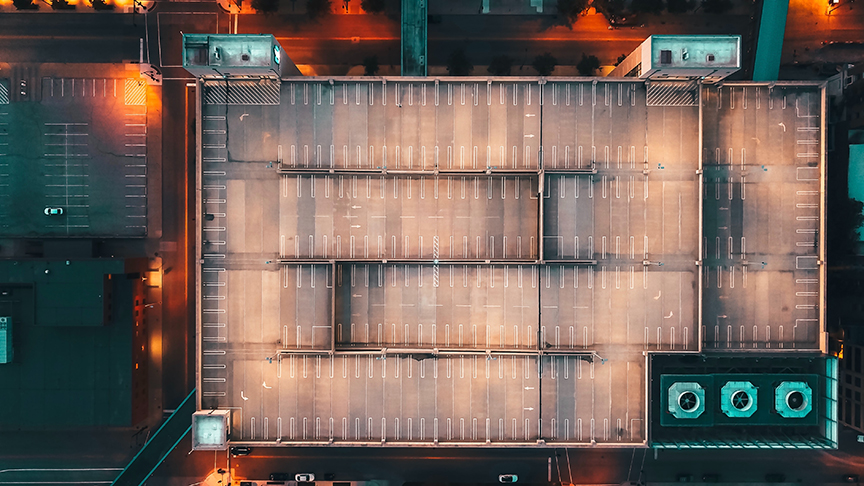 Aerial shot exactly above a parking lot in downtown Des Moines Iowa