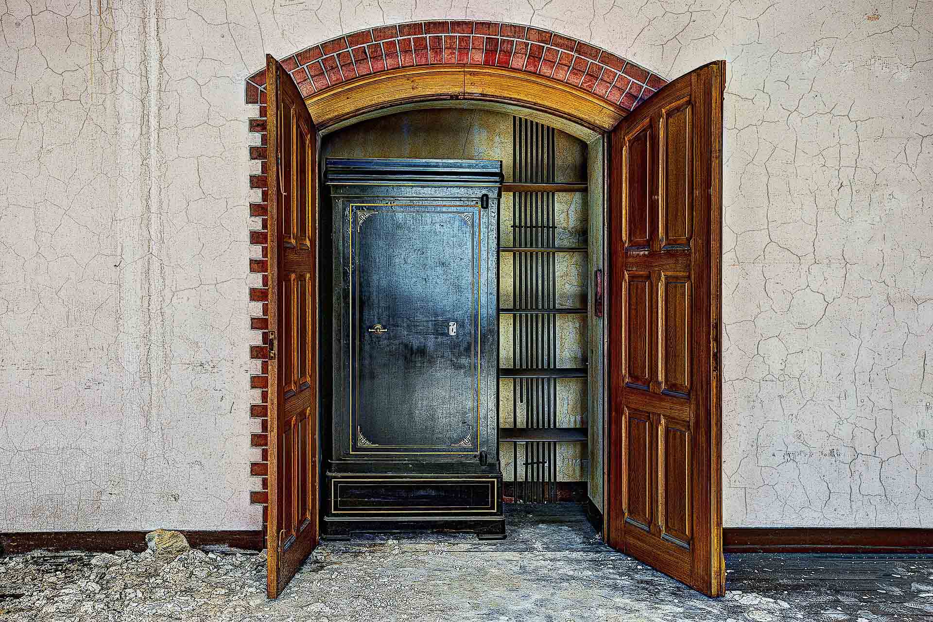 A large black safe in a closet