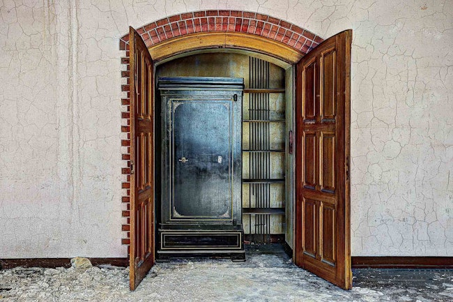 A large black safe in a closet