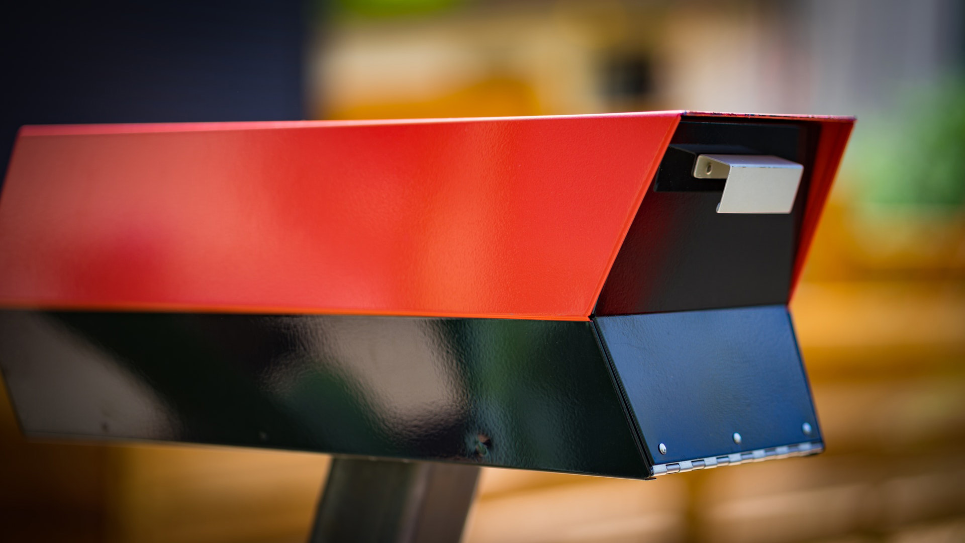 A red and black modern style mailbox 