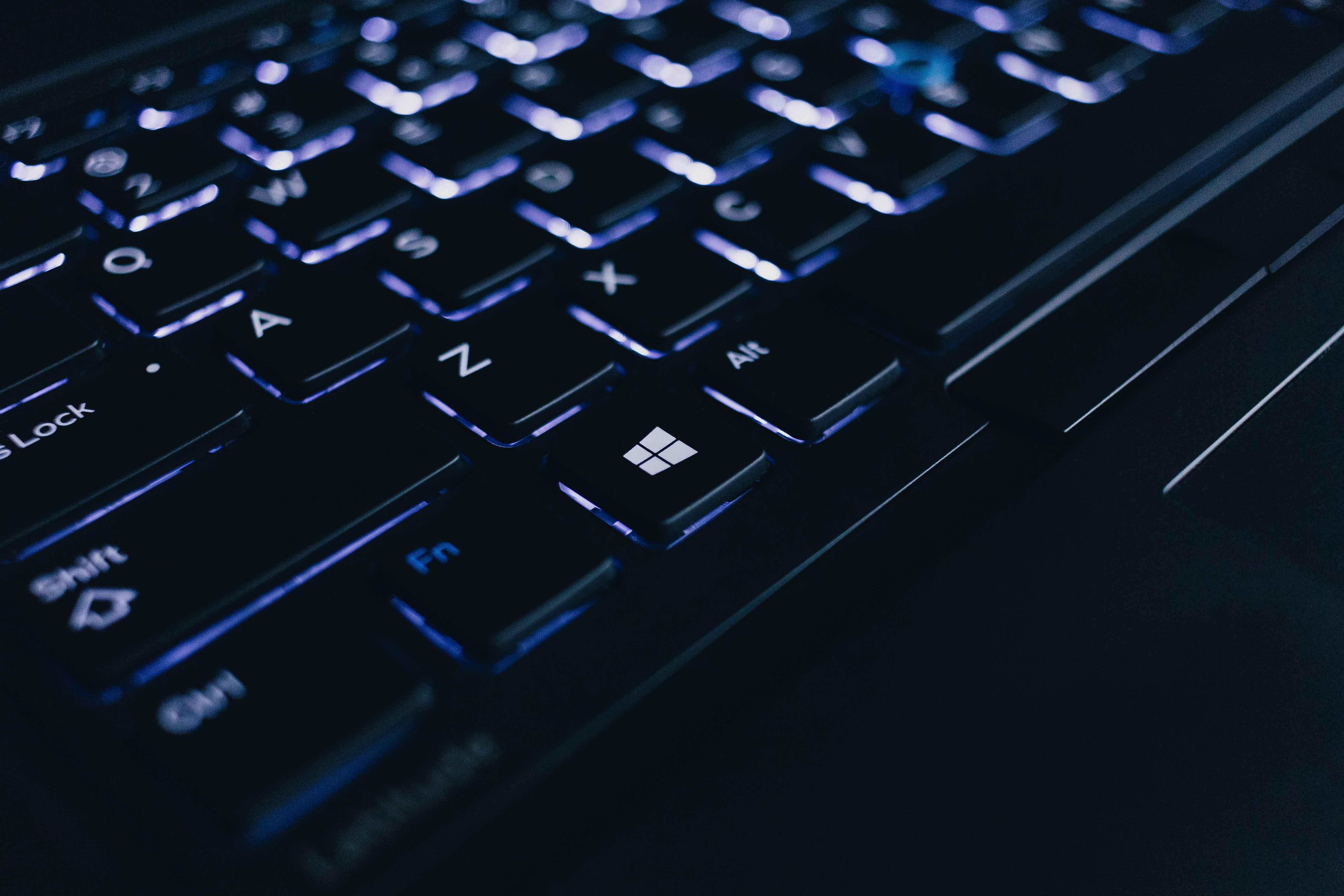 A lit up laptop keyboard