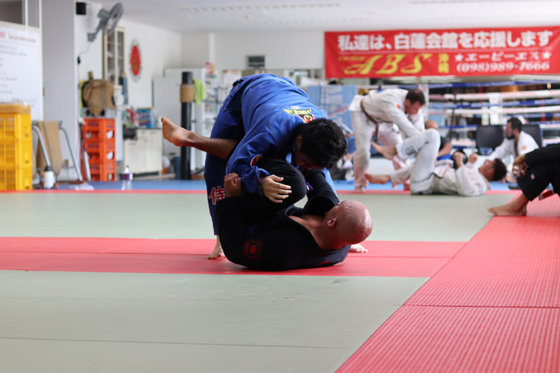 Two people practicing martial arts self defense.