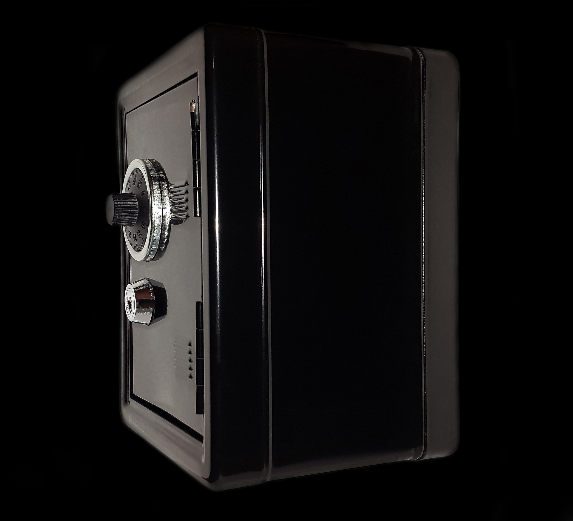A dark colored combination lock safe perfect for storing jewelry.
