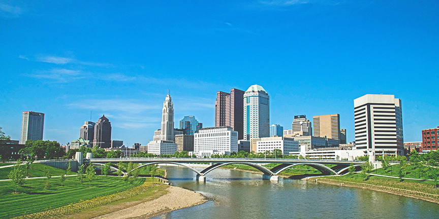 Columbus Ohio Skyline during the day with green grass and trees