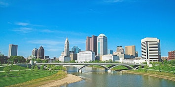 Columbus Ohio Skyline during the day with green grass and trees