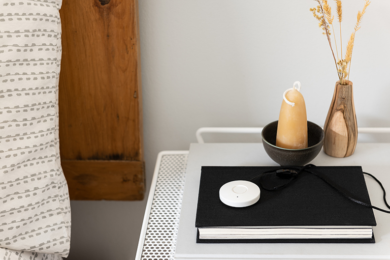 Medical Alert System Necklace On Bedside Table