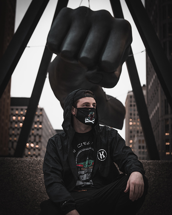 Michigan Criminal in Front of Fist Statue