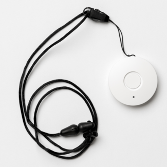 A medical button attached to a black necklace on a white background.