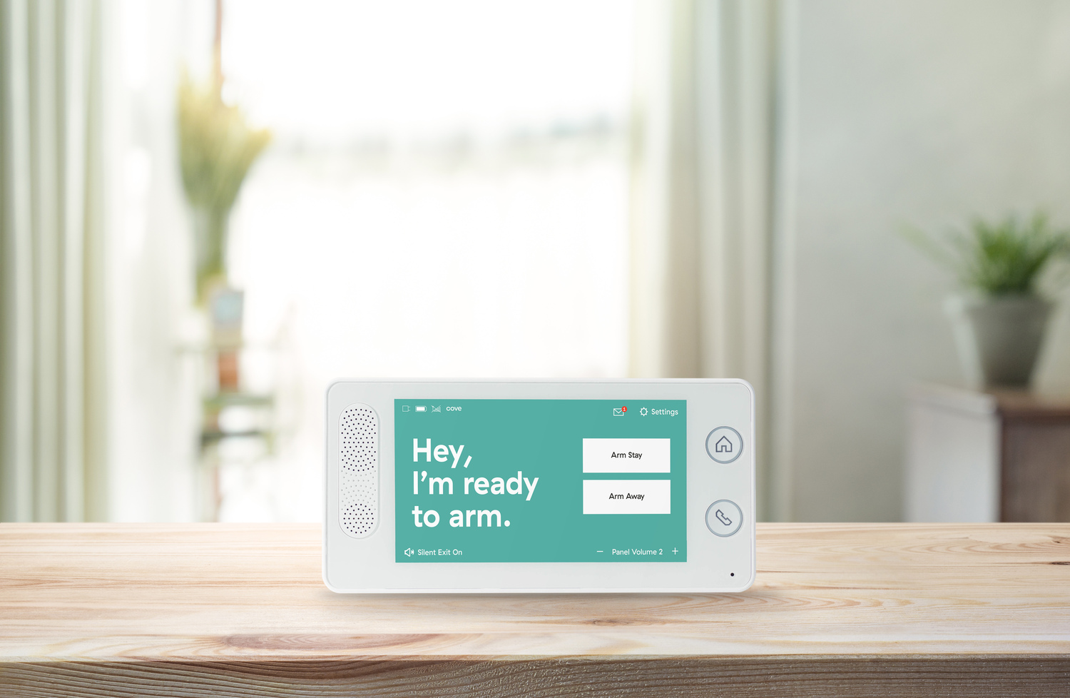 Cove Alarm Touch Panel on Wooden Table