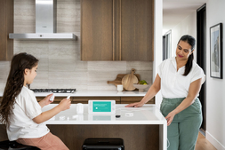 A mom and child with cove smart devices.