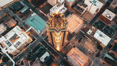 Aerial view of downtown Des Moines including the 801 Grand skyscraper at sunset.