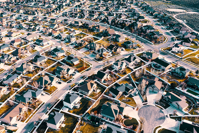 Aerial shot of several housing communities during the fall