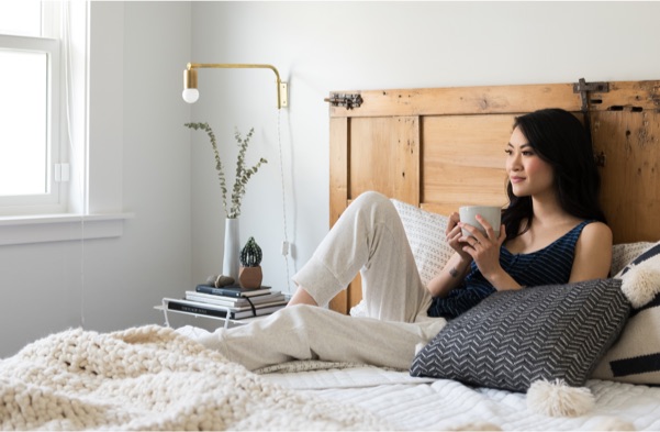 Women drinking coffee in bed