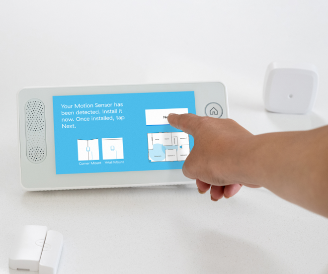 person adding sensors to panel