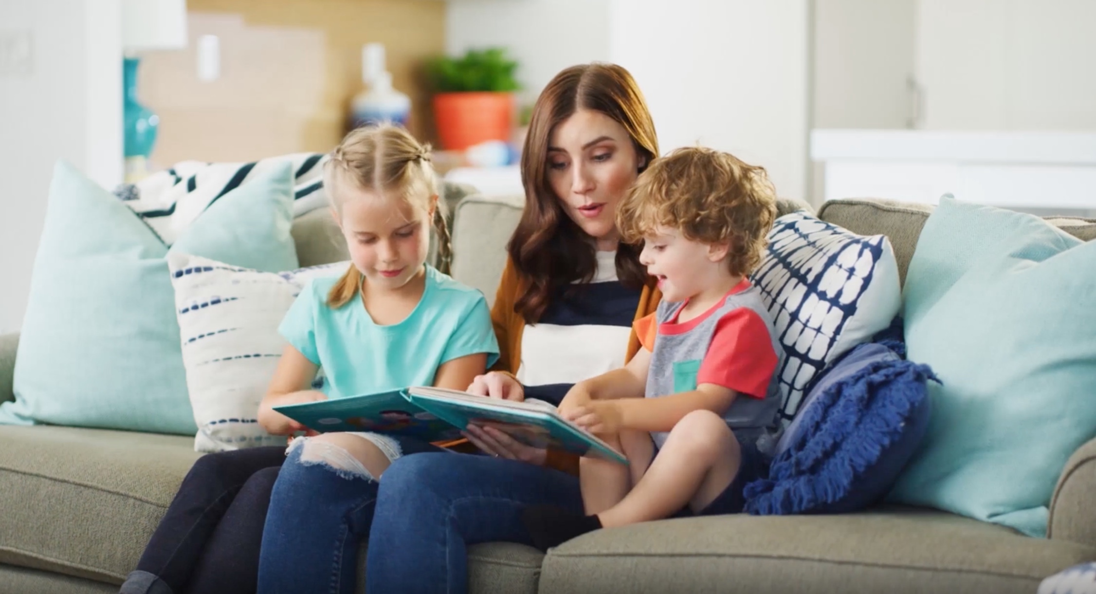 mom reading book with kids