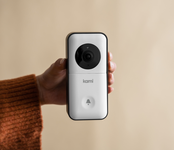 Hand Holding Kami Doorbell Camera